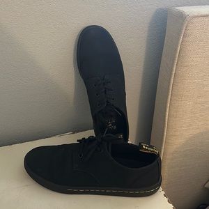 Dr. Martins black tennis shoes.